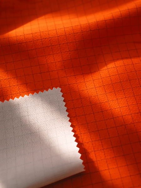 300D * 300D Conductive Grid Fabric with Flame Retardant Milky Coating (Hi-Vis Orange)